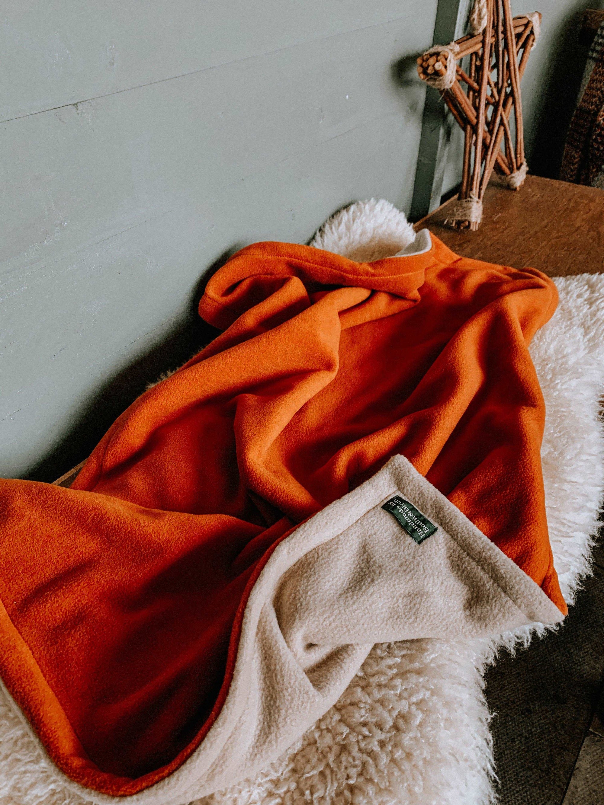 Bodhi &amp; The Birchtree burnt orange anti pill fleece dog blanket. Handmade in Scotland.